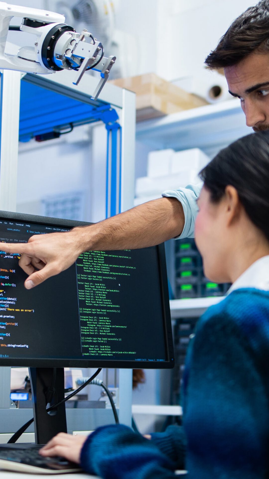 Meeting asian and caucasian Engineers Maintenance Robot Arm at Lab. they are in a High Tech Research Laboratory with Modern Equipment. Professional Japanese Development Engineer Testing an Artificial Intelligent.